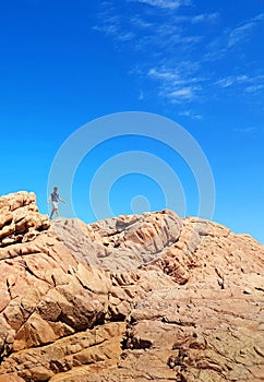 Man hiking on spectacular rocks.