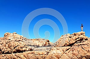 Man hiking on spectacular rocks.