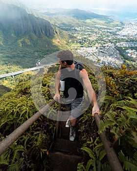 Man Hiking Stairway to Heaven (Haiku Stairs) on Oahu, Hawaii.