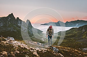 Man hiking survival in mountains alone outdoor active lifestyle