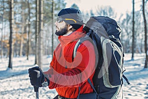 Man hikking at snowy mountain forest
