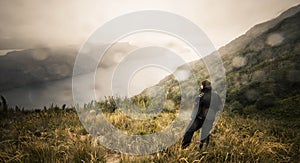 Man on the hill looking over the river