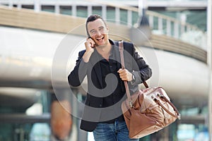 Man in his 30s walking and talking in the city