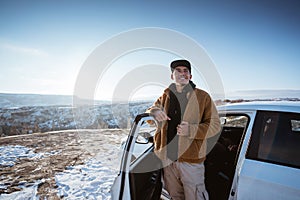 man on his adventure going to beautiful hill in cappadocia by his car
