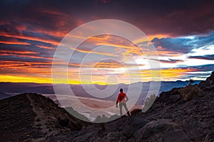 man with his backpack admiring the sunset at Dante\'s View in death valley