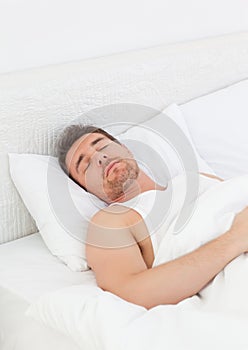 A man in his bed before waking up