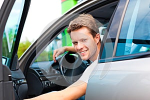 Man in his car at petrol station