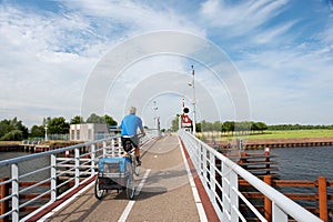 Man with his doggy ride on the bike