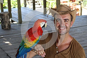 Man and his domesticated parrot