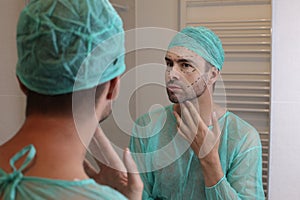 Man with his face all marked and ready for plastic surgery