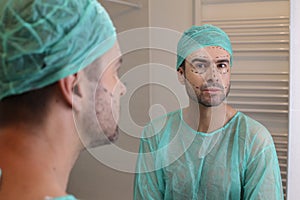 Man with his face all marked and ready for plastic surgery