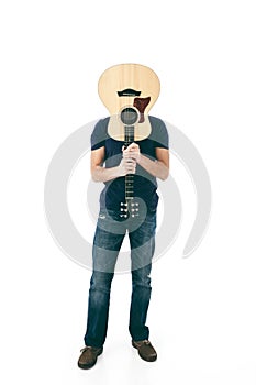 Man with his face hidden from guitar
