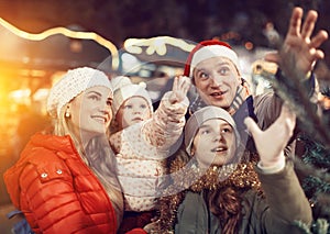 Man and his family buying Christmas tree