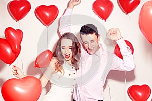 Man with his lovely sweetheart girl dance and have fun at Lover`s valentine day. Valentine Couple. Couple very happy, party time