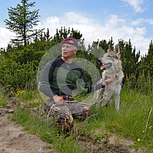 Man and his purebred Czechoslovakian wolf dog