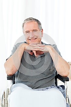 Man on his wheelchair looking at the camera