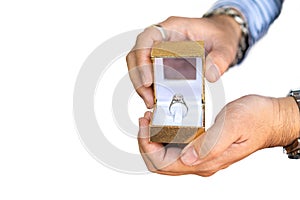 Man hold box with beautiful and luxury wedding diamond ring on two hand isolated on white background with clipping path