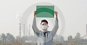 Man hold green billboard