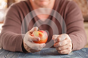 Man hold one apple in hand