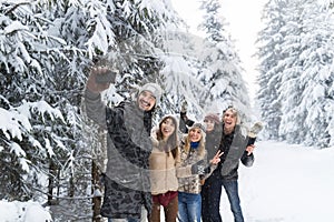 Man Hold Smart Phone Camera Taking Selfie Photo Friends Smile Snow Forest Young People Group Outdoor