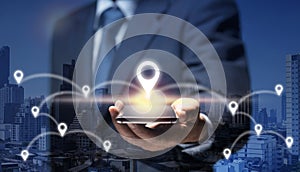 Man hold smart Phone connect to GPS location icon show global business, direction, travel, 5G concept. Businessman use internet