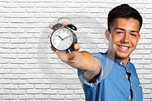 Man holding an alarm clock