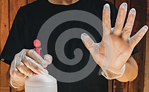 Man holding alcohol gel as biosafety protocol photo
