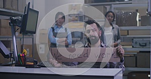 Man holding anti-lockdown message