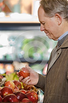 A man holding an apple photo