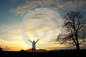 Man holding arms up in praise photo