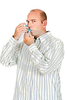 Man holding asthma medicine inhaler