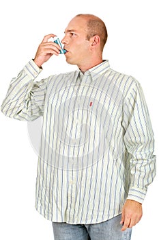 Man holding asthma medicine inhaler