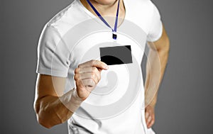 Man holding a badge. Close up. Isolated background