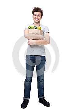 Man holding a bag full of groceries