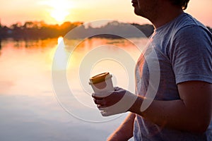 Man holding a bamboo cup with coffee