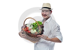 Man holding a basket of vegetables in hands