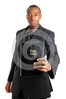 Man holding a bible showing commitment