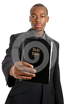 Man holding a bible showing commitment