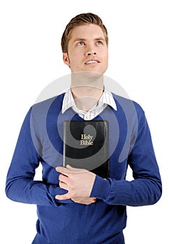 Man holding a bible showing commitment