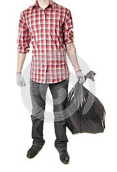 Man holding black plastic trash bag