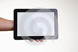 Man holding black tablet frame in hand