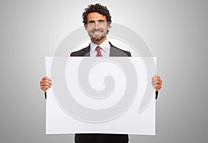 Man holding a blank board.
