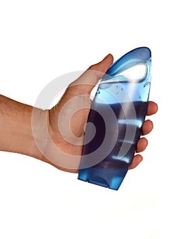 Man holding blue shower gel