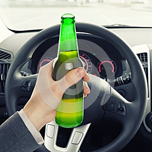 Man holding bottle of beer while driving - 1 to 1 ratio