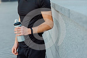 Man holding bottle of water