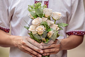 A man holding a bouquet of roses, Selective focus Holiday