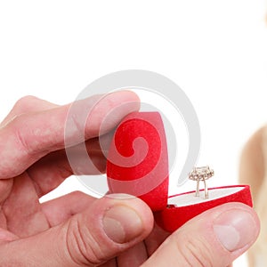 Man holding box with ring making propose