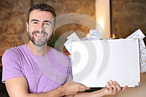 Man holding briefcase full of cash