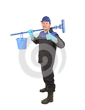 Man holding broom and bucket.