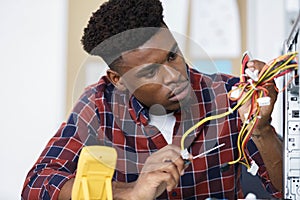 man holding cables in hand